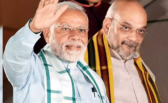 Shah congratulates Modi on clocking 23 years of holding Constitutional posts