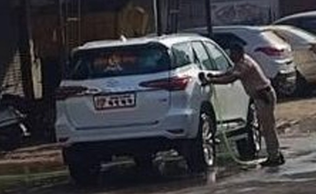 Policemen Cleaning Shiv Sena MLA's Car