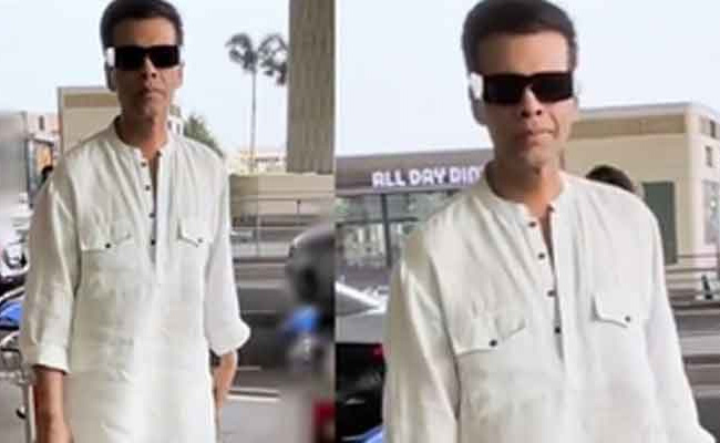 Karan Johar breaks his airport fashion stereotype with sombre outfit   