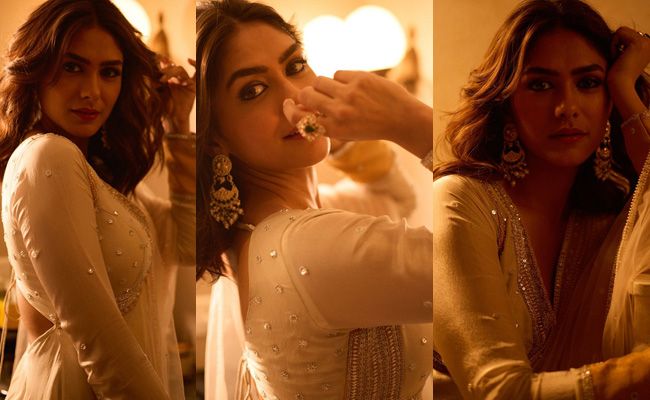 Mrunal Thakur showcases her golden look in dim lighting